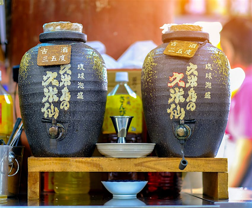 Two jars of sake on display at a Sashimi restaurant in Okinawa Island