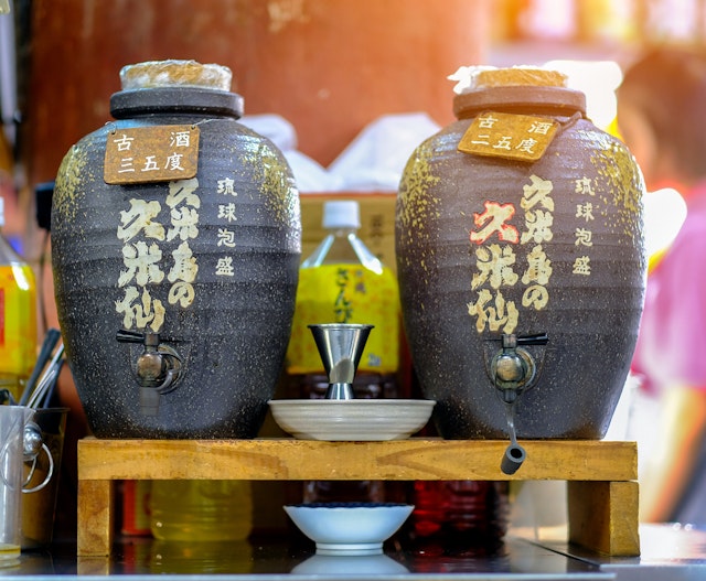 Two jars of sake on display at a Sashimi restaurant in Okinawa Island