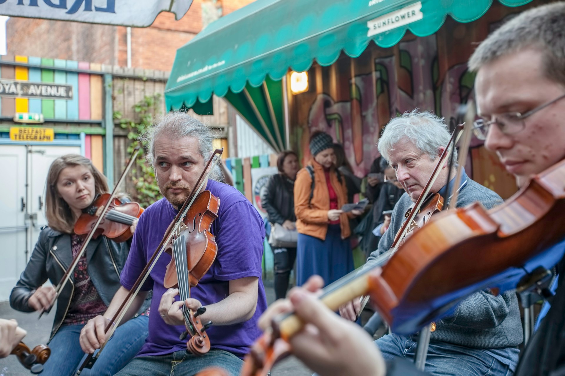 Traditional fiddle players perform an impromptu jam at the Sunflower Public House.
