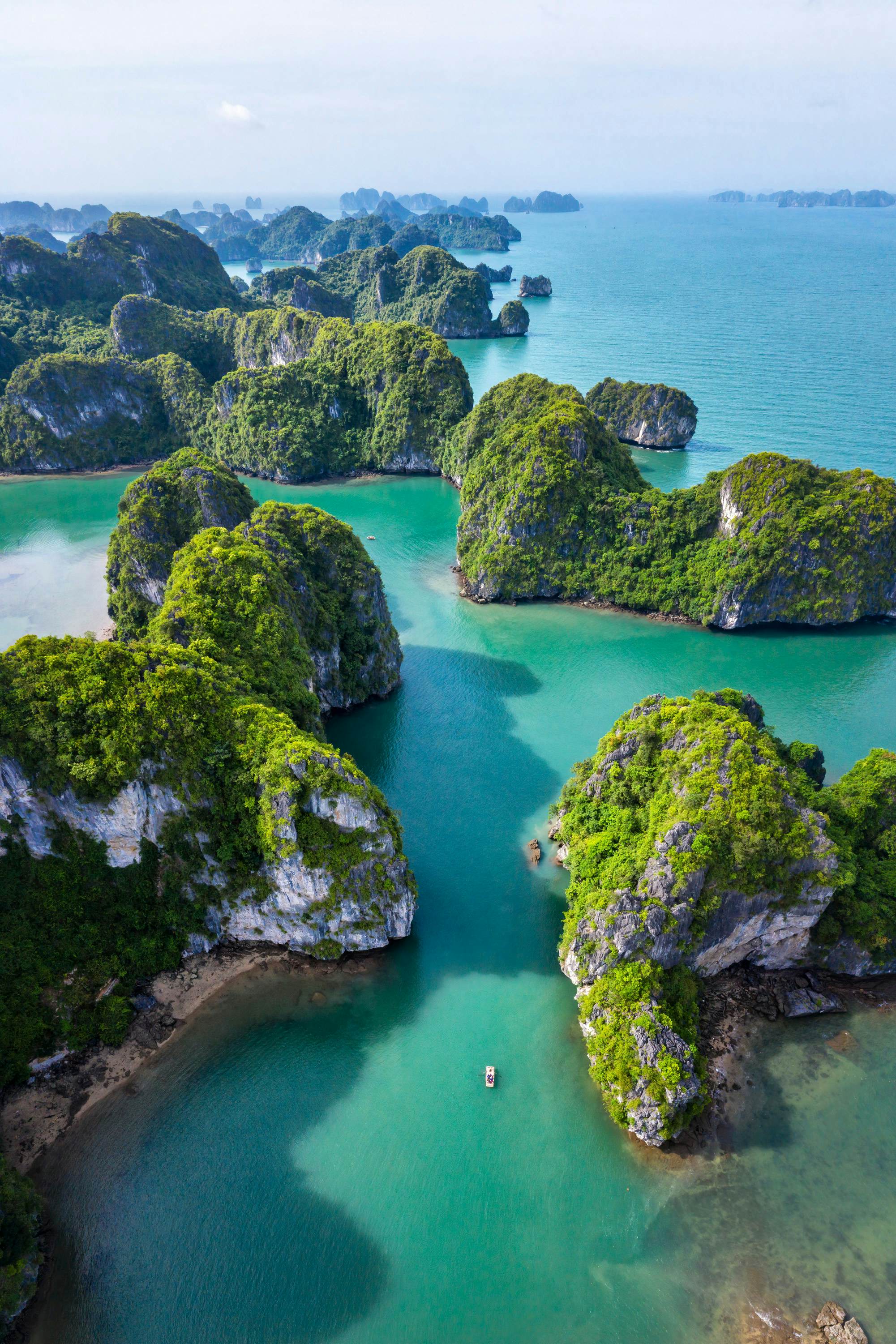Aerial of Vung Vieng floating fishing village and rock island in Halong Bay. 
