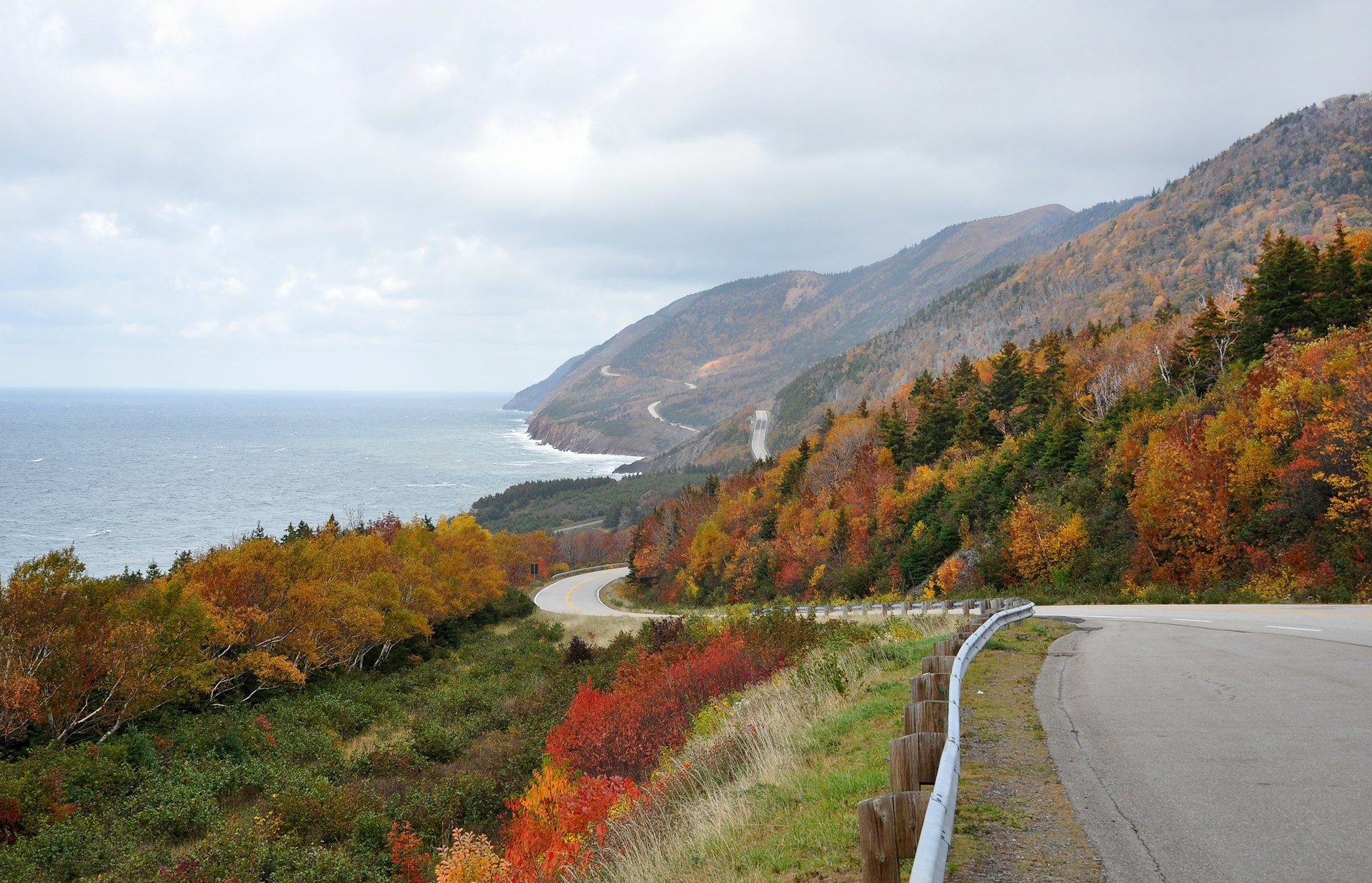 A road snaking around a hilly coastal road