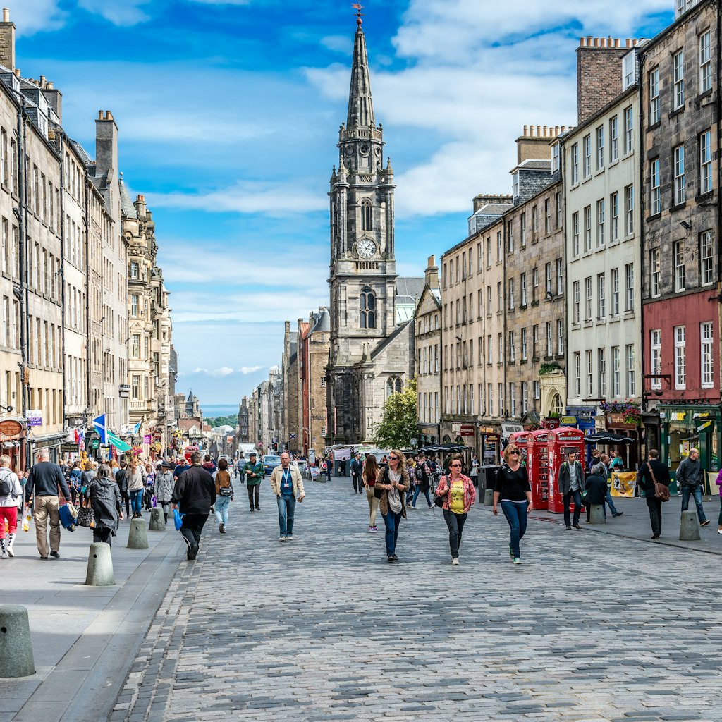 EDINBURGH, SCOTLAND - SEPTEMBER 09, 2013: Edinburgh's busy Royal Mile (The Highstreet) is one of the most iconic streets in Scotland and a mayor tourist attraction