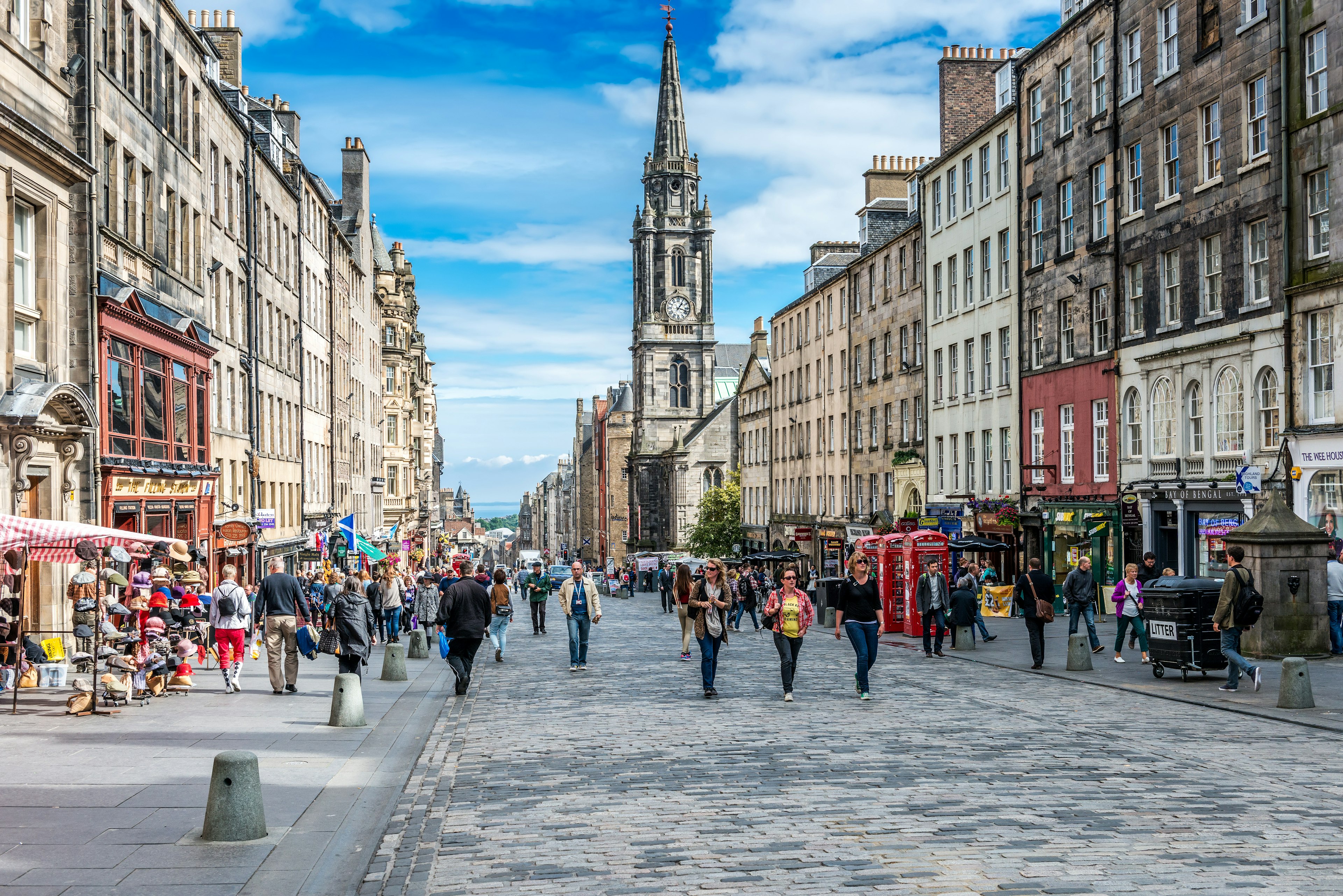 EDINBURGH, SCOTLAND - SEPTEMBER 09, 2013: Edinburgh's busy Royal Mile (The Highstreet) is one of the most iconic streets in Scotland and a mayor tourist attraction