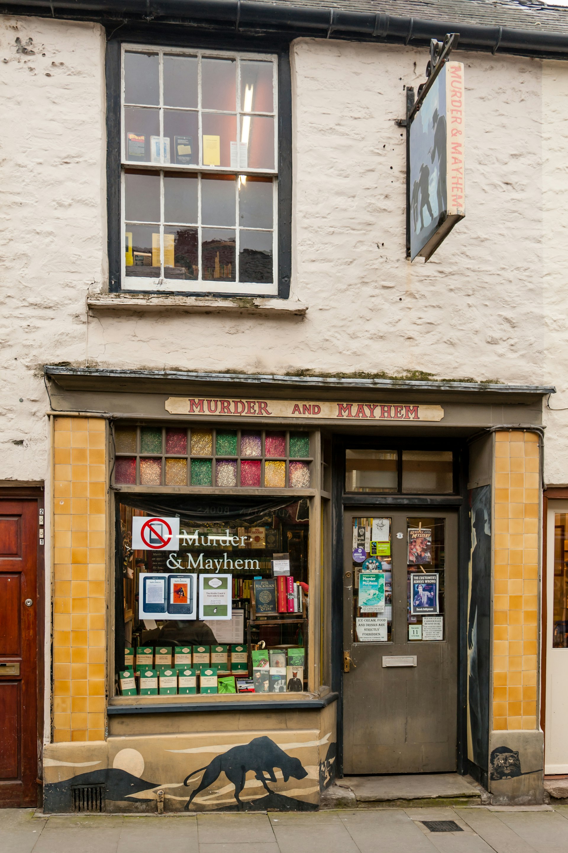 The facade of an old book store named Murder and Mayhem