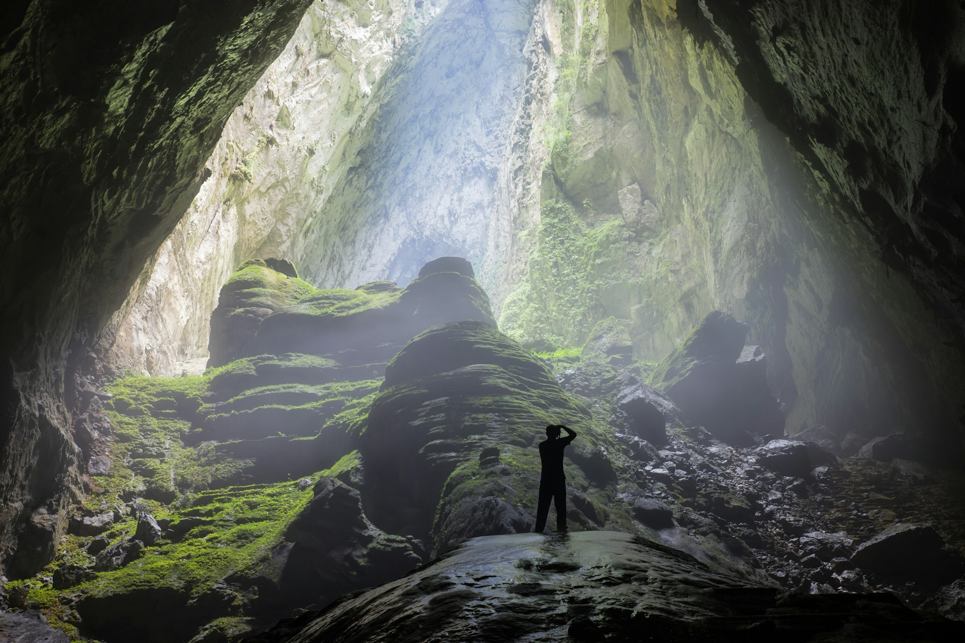 Man at the cave entrance in Son Doong Cave, the largest cave in the world in UNESCO World Heritage Site Phong Nha-Ke Bang National Park