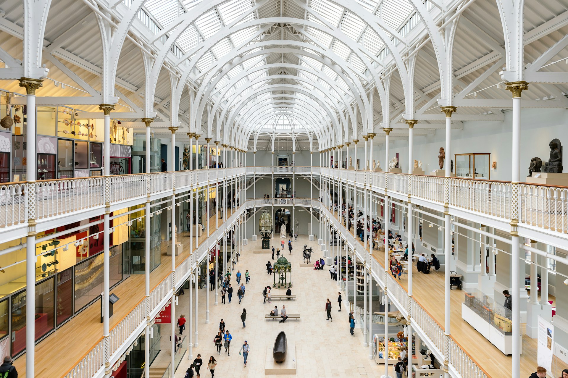An aerial view of people walking through the Grand Gallery of the National Museum of Scotland.