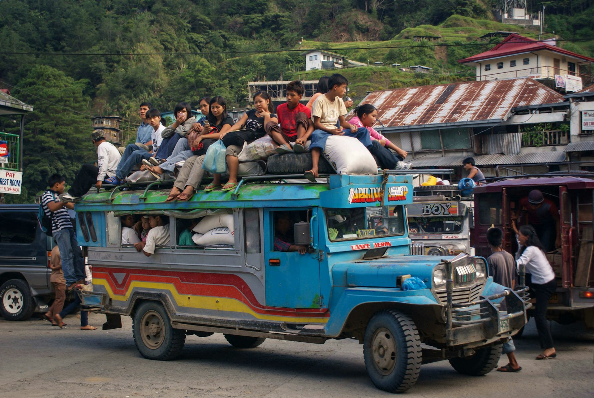 Passengers on jeepney roof