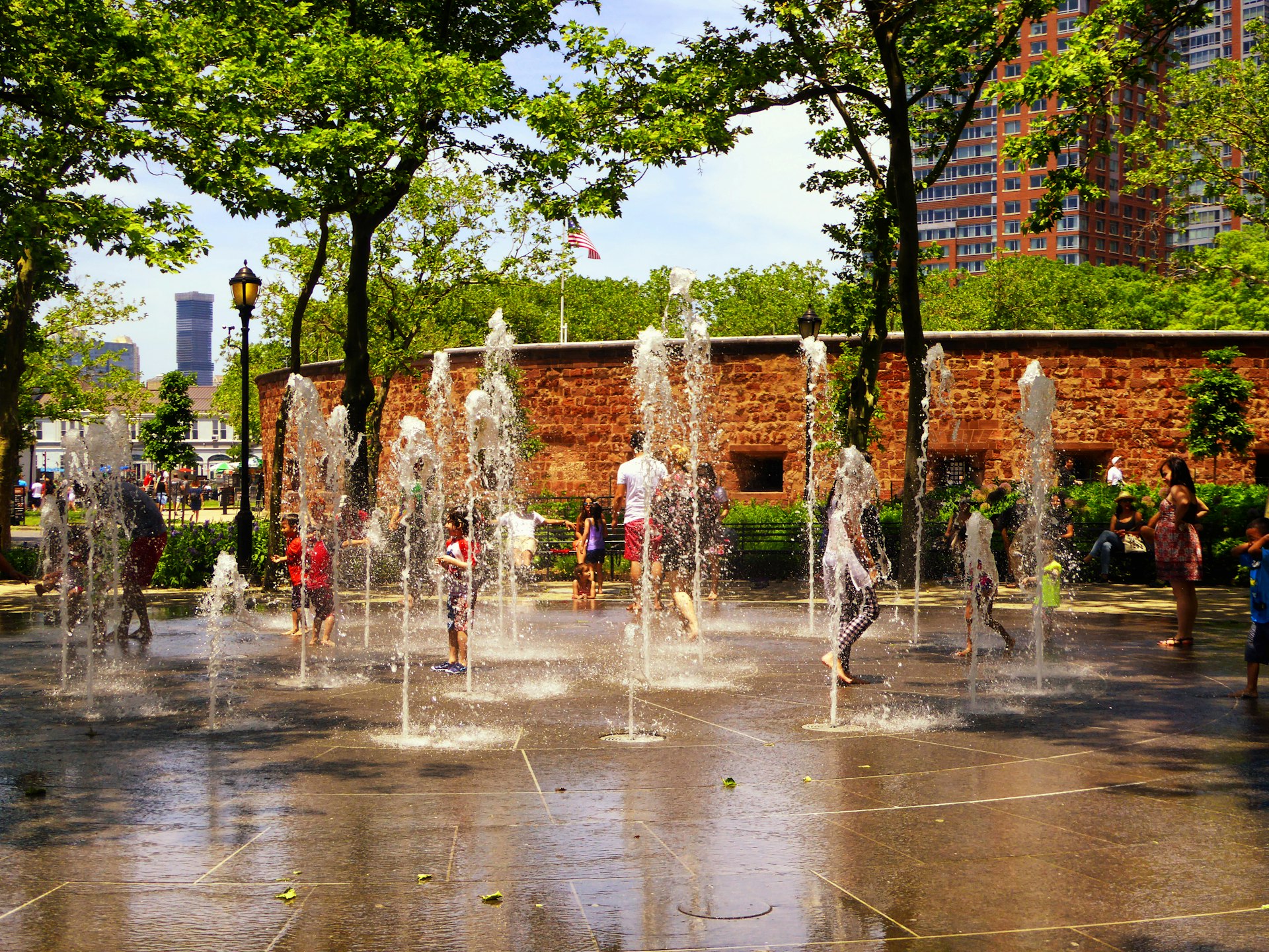 Jumping fountains in the summer at Castle Clinton National Monument, a circular sandstone fort Battery Park, New York City