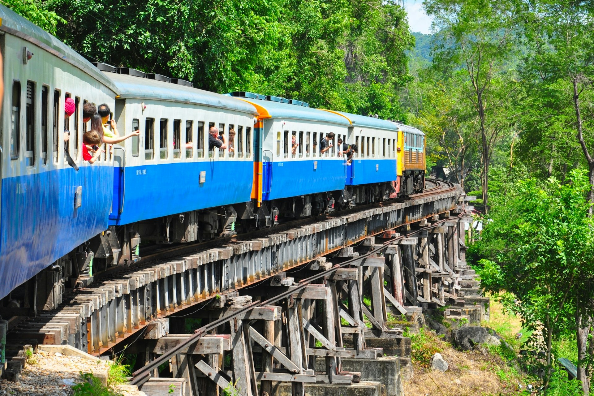 A train goes through the Thailand countryside