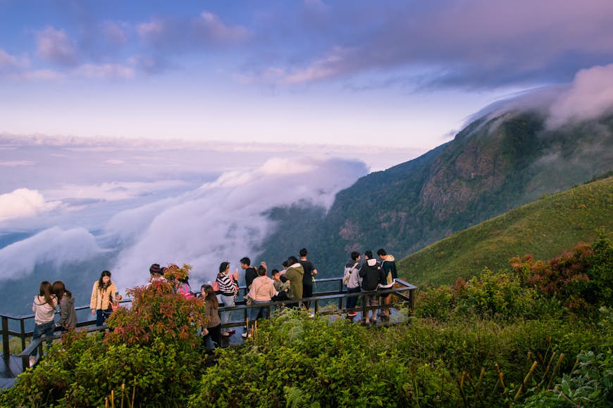 Tourists gather on a lookout point on the Kew Mae Pan Nature Trail, Chomthong District, Chiang Mai of Thailand