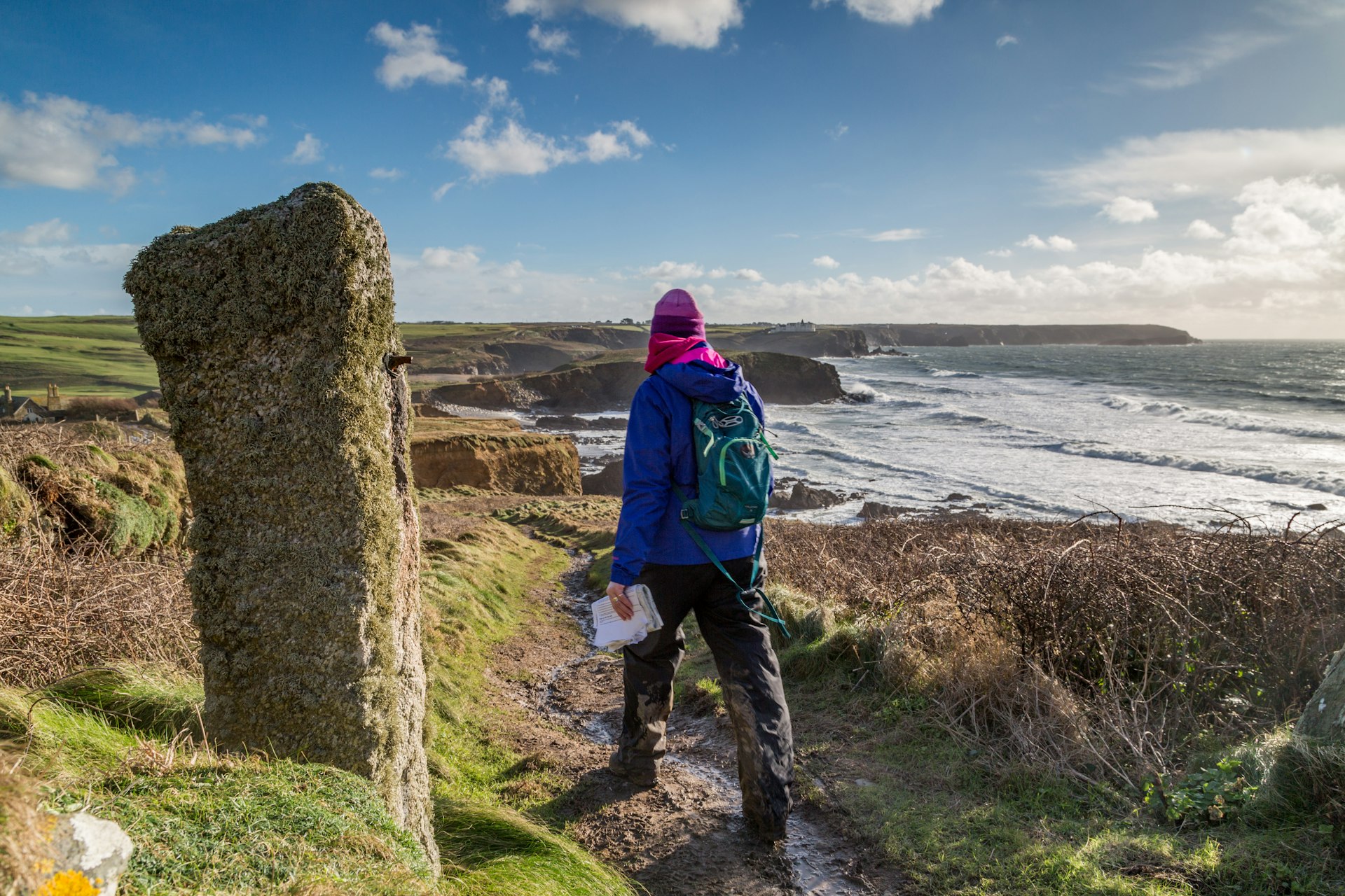 Hiker walking on the coast path in Cornwall