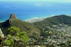 A panoramic view of Lions Head, Signal Hill, Robben Island, and Cape Town, South Africa, as seen from the top of Table Mountain.