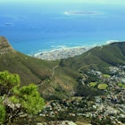 A panoramic view of Lions Head, Signal Hill, Robben Island, and Cape Town, South Africa, as seen from the top of Table Mountain.