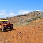 Aruba - June 22, 2017: Arikok Natural Park on the island of Aruba in the Caribbean Sea with deserts and ocean waves on the rocky coast;