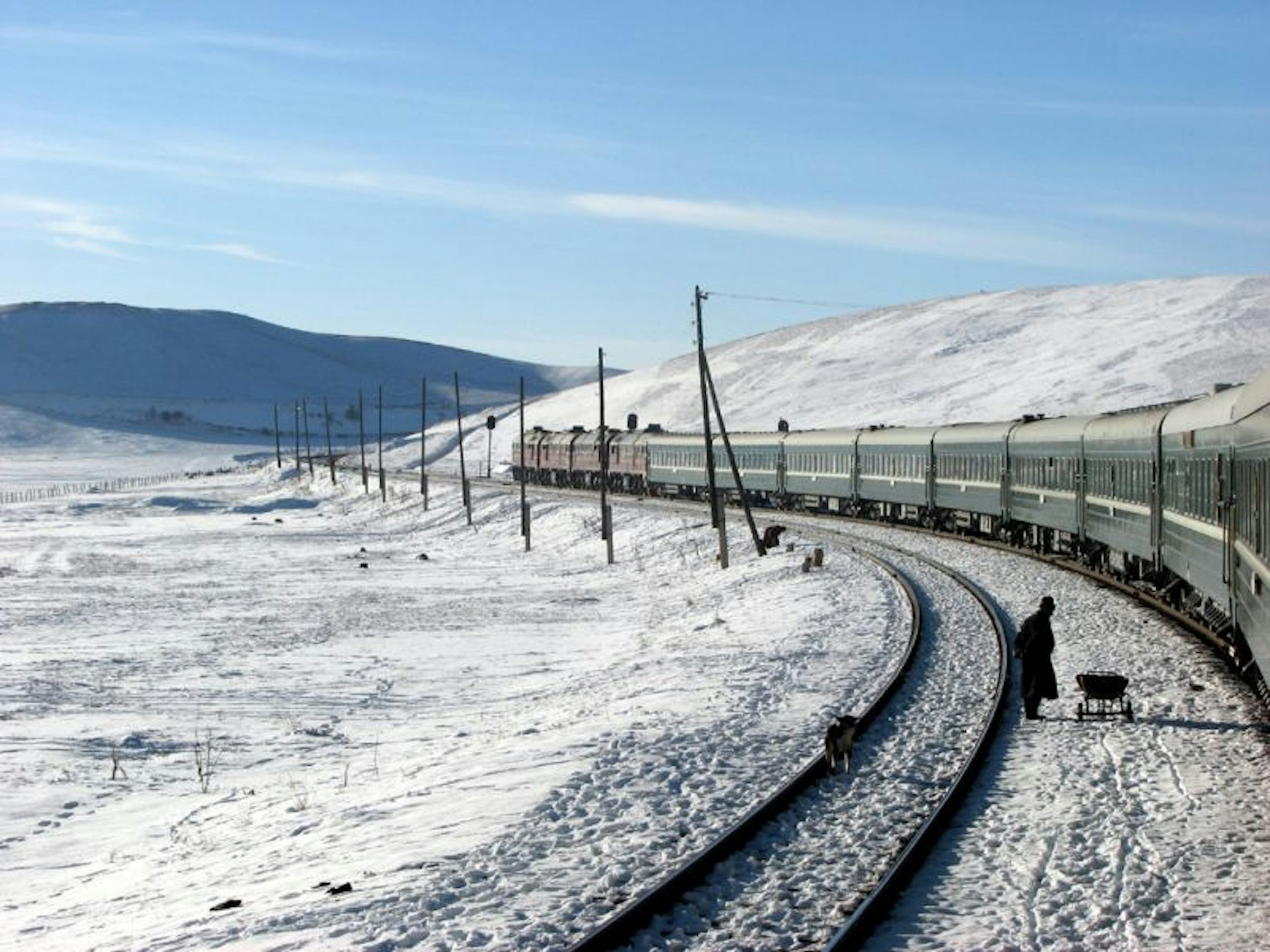 A train on the Trans-Mongolian line on a snowy day 