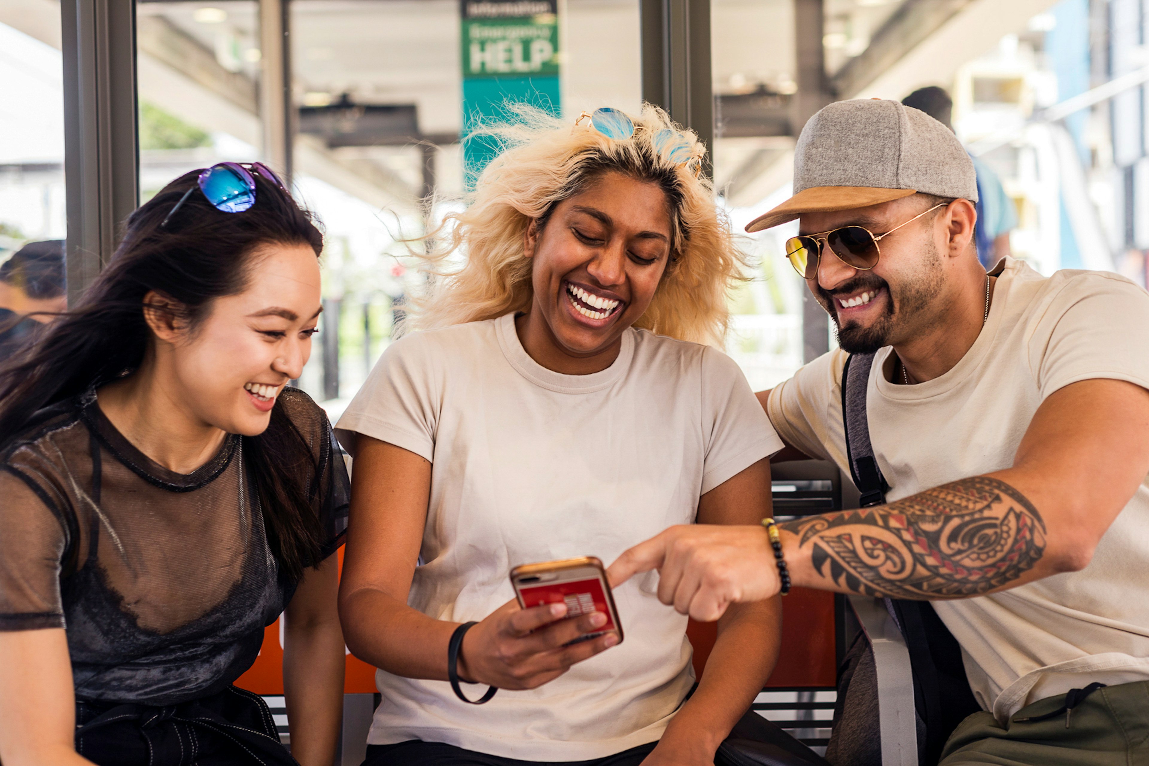 Friends Laughing Over Something On The Phone