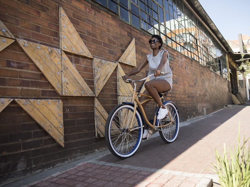 Woman riding a bicycle in South Africa 