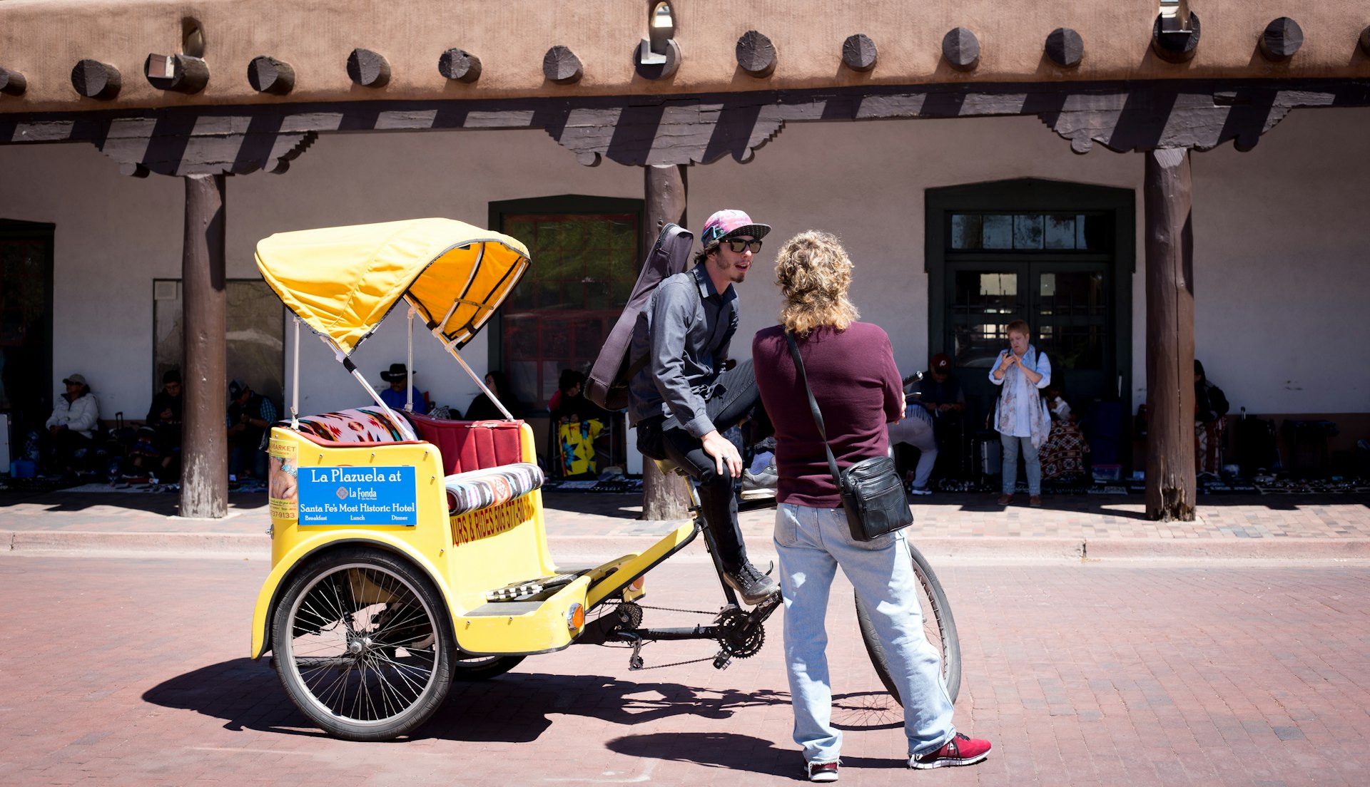 A Santa Fe pedicab outside the Palace of the Governors. The pedicab is essentially a pedal rickshaw, which is used to cycle people around the city.