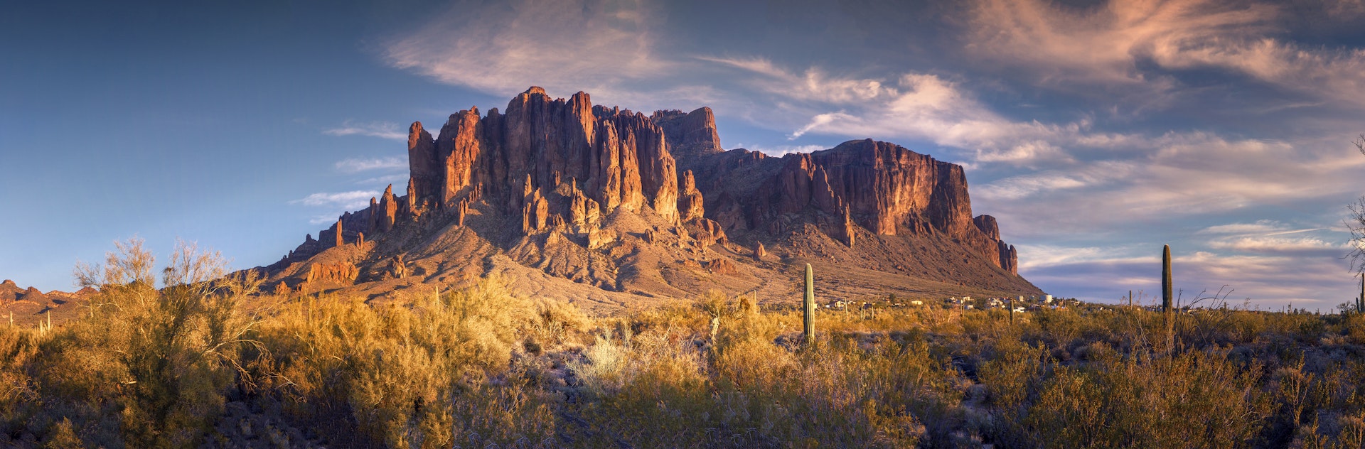 Panoramic view of Superstition Mountain near barren lands of Phoenix