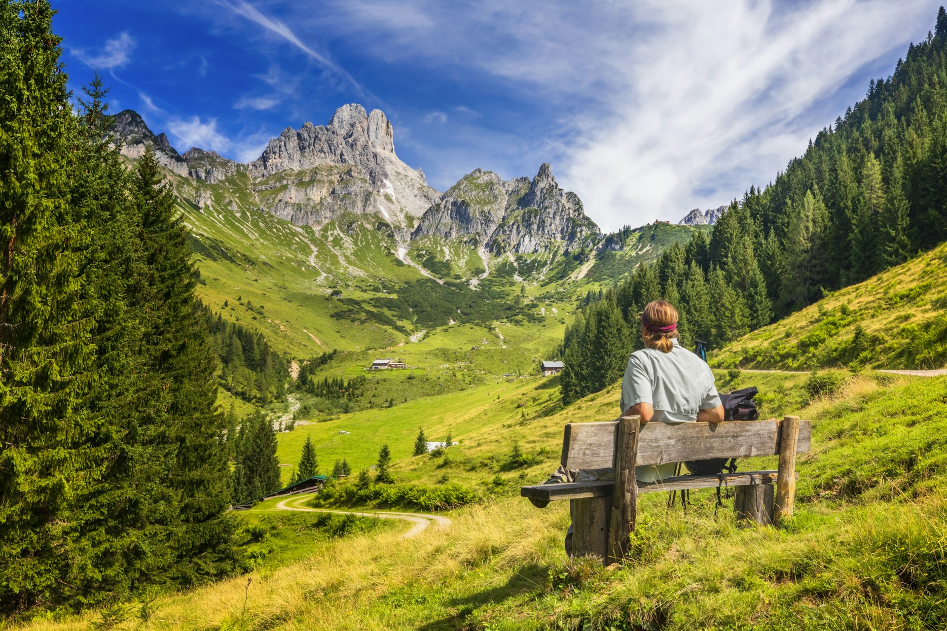 A man admiring the Alpine landscapes in the Dachstein Massif