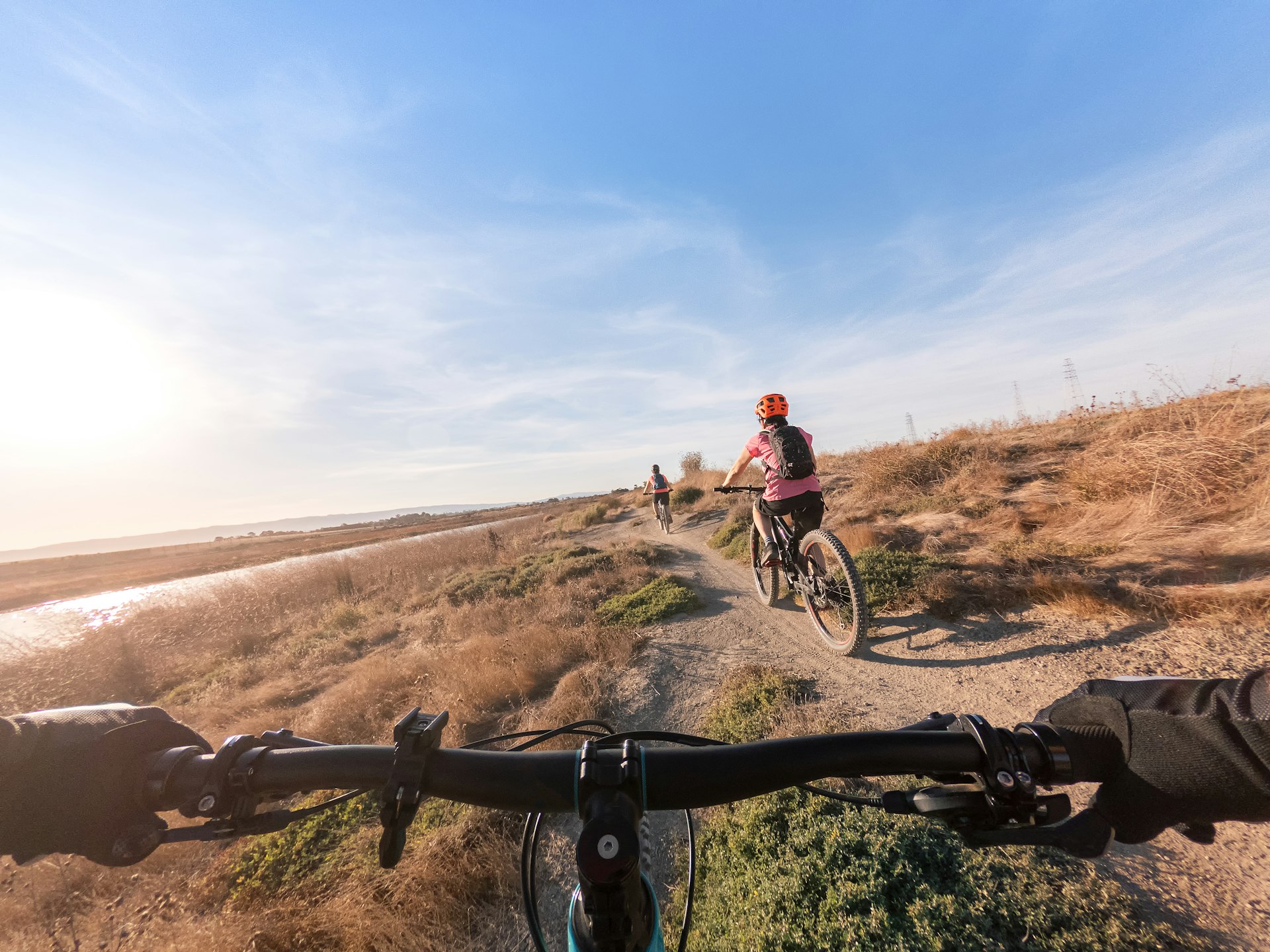 A family cycling on the shoreline near the Santa Clara Valley