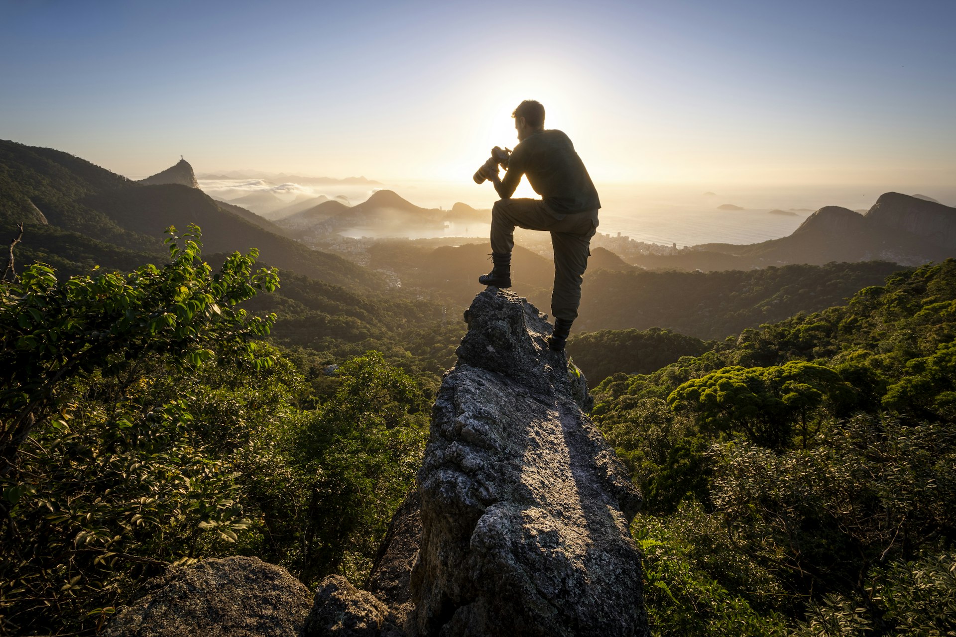 A man photographs the Atlantic forest near Rio de Janeiro