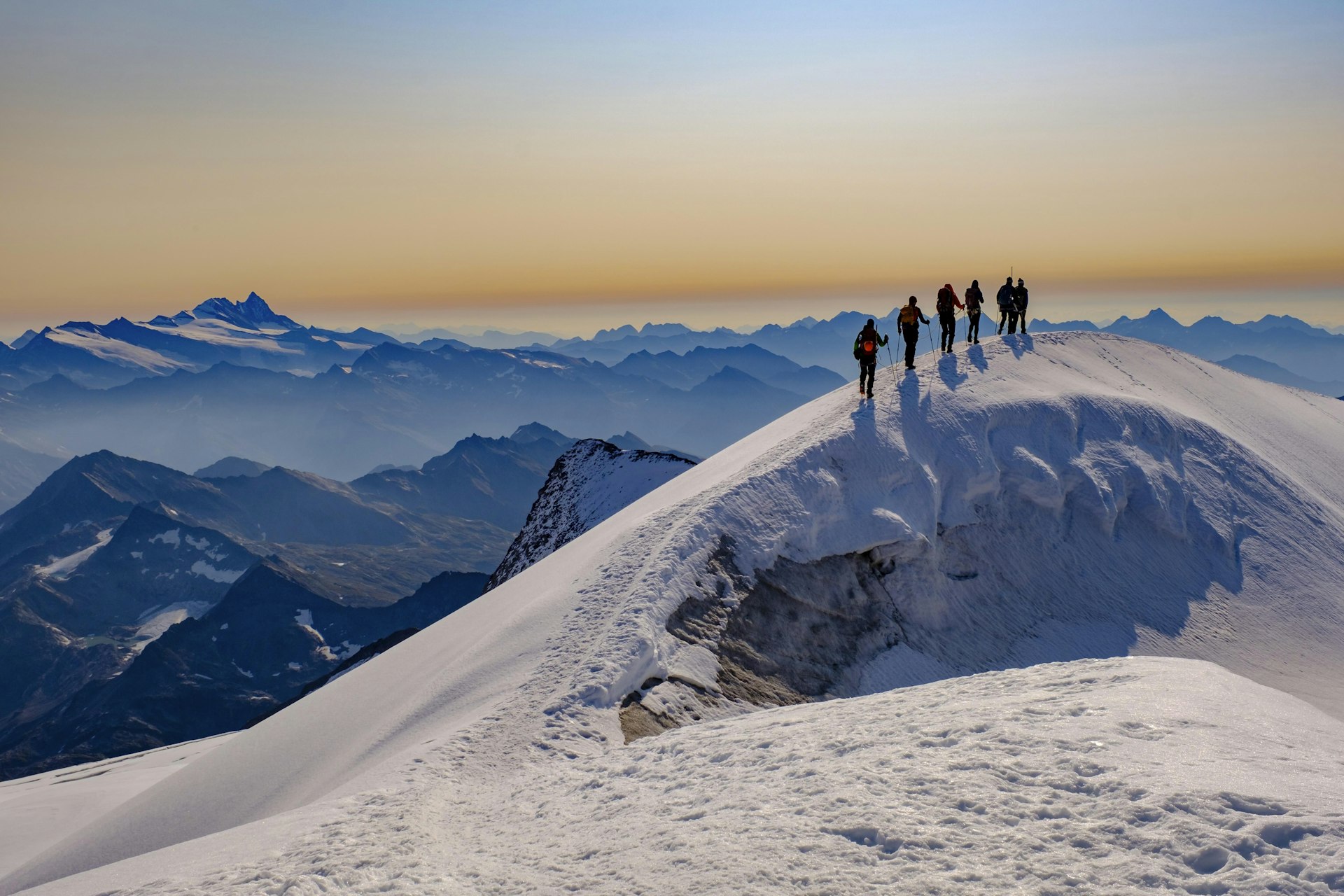 Mountaineers on snowy summit in Hone Tauern National Park