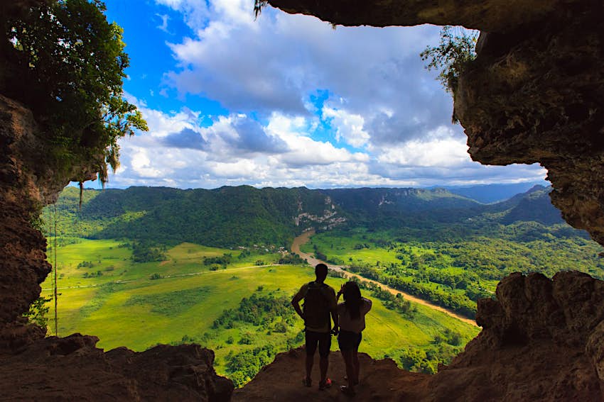 A couple admire the views from the Cueva Ventana