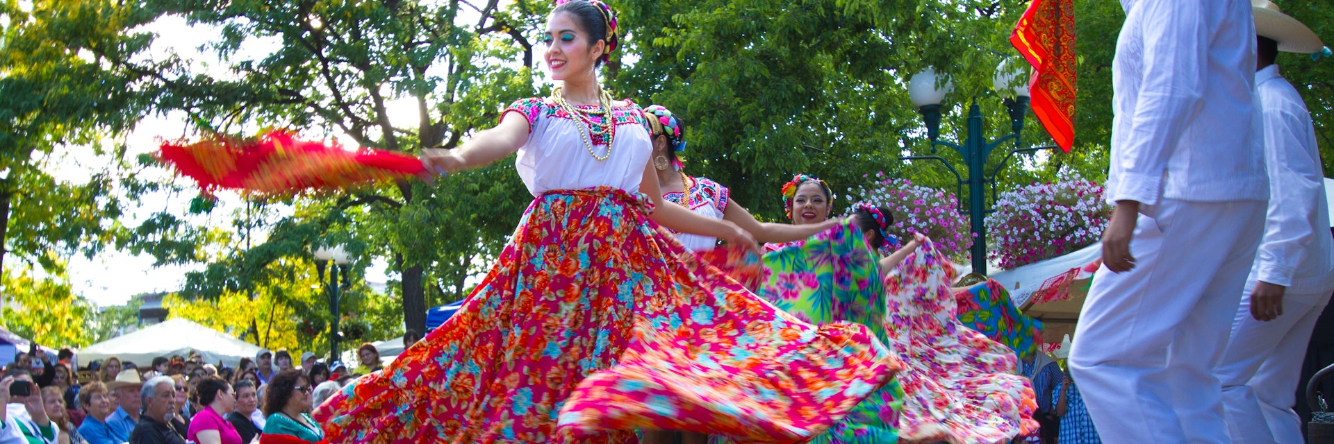Santa Fe, NM, USA - September 17, 2016: A dance troupe performs a Mexican folk dance on the historic Santa Fe, NM Plaza during a Mexican Independence Day celebration. New Mexico was part of the Mexican Republic for 25 years and has many citizens of Mexican heritage.