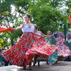 Santa Fe, NM, USA - September 17, 2016: A dance troupe performs a Mexican folk dance on the historic Santa Fe, NM Plaza during a Mexican Independence Day celebration. New Mexico was part of the Mexican Republic for 25 years and has many citizens of Mexican heritage.
