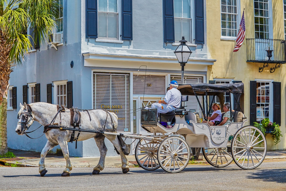 Visitors take a ride on Charleston's Old horse drawn Carriages,Charleston,South Carolina,USA
