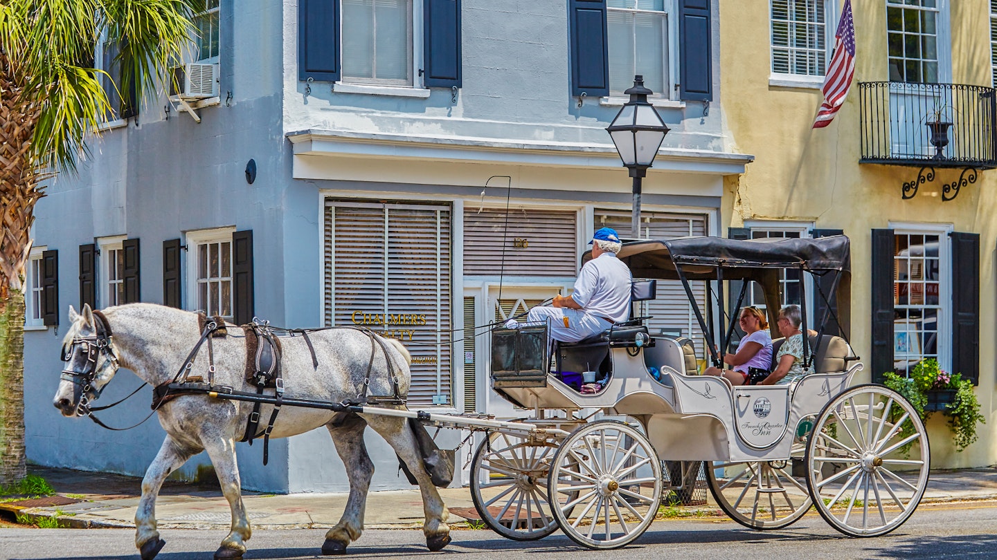 Visitors take a ride on Charleston's Old horse drawn Carriages,Charleston,South Carolina,USA