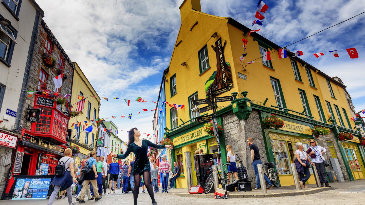 Traditional folk dancer dancing in Galway village center