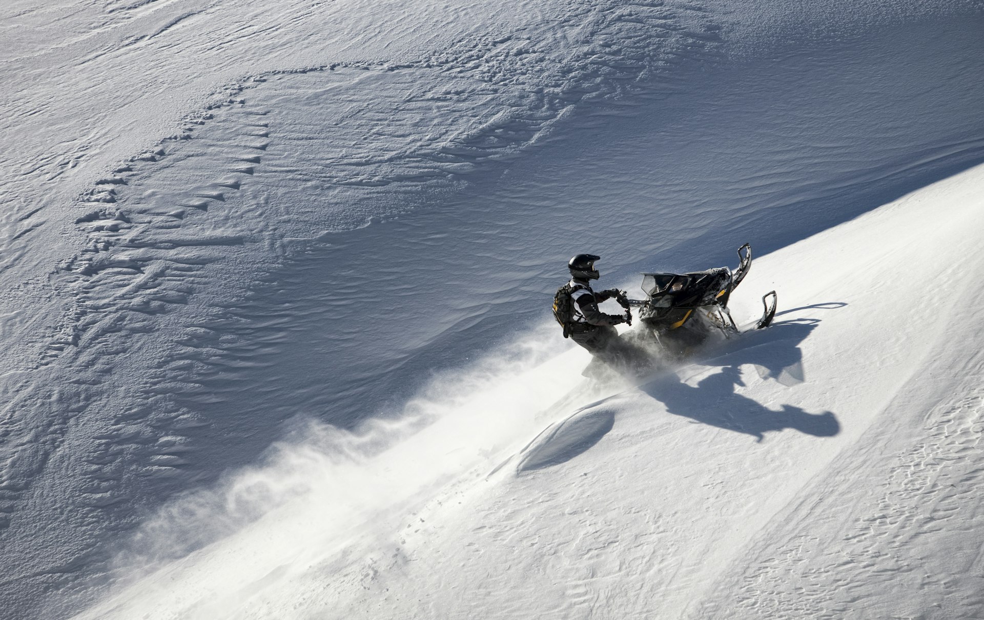 Snowmobile climbing a steep slope in Montana