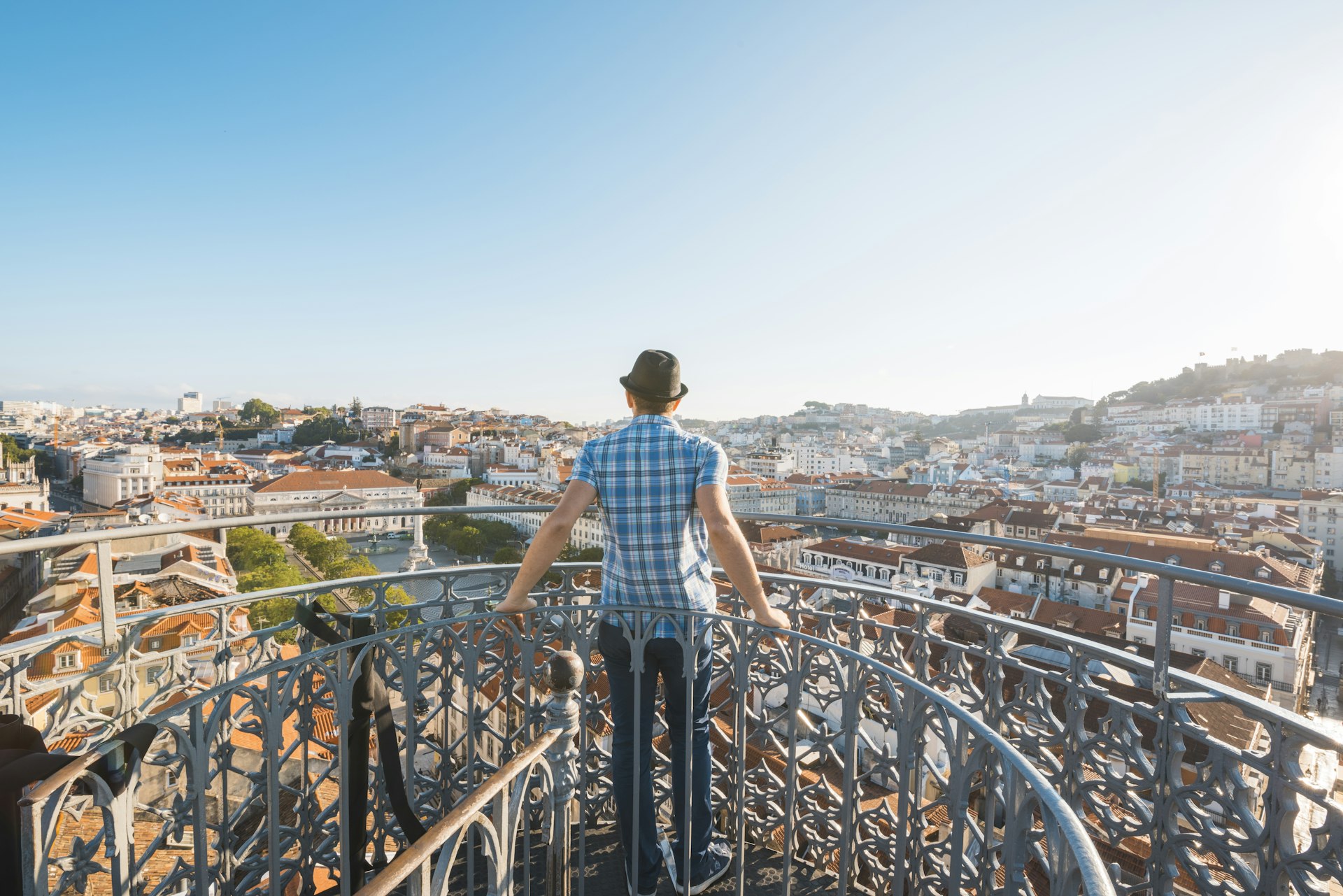 Tourist admiring the view from the Elevador de Santa Justa, Lisbon
