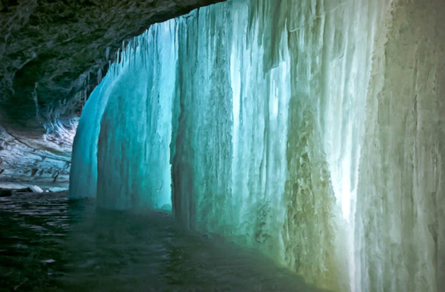 A blue wall of ice is formed by the water of Minnehaha Falls. 