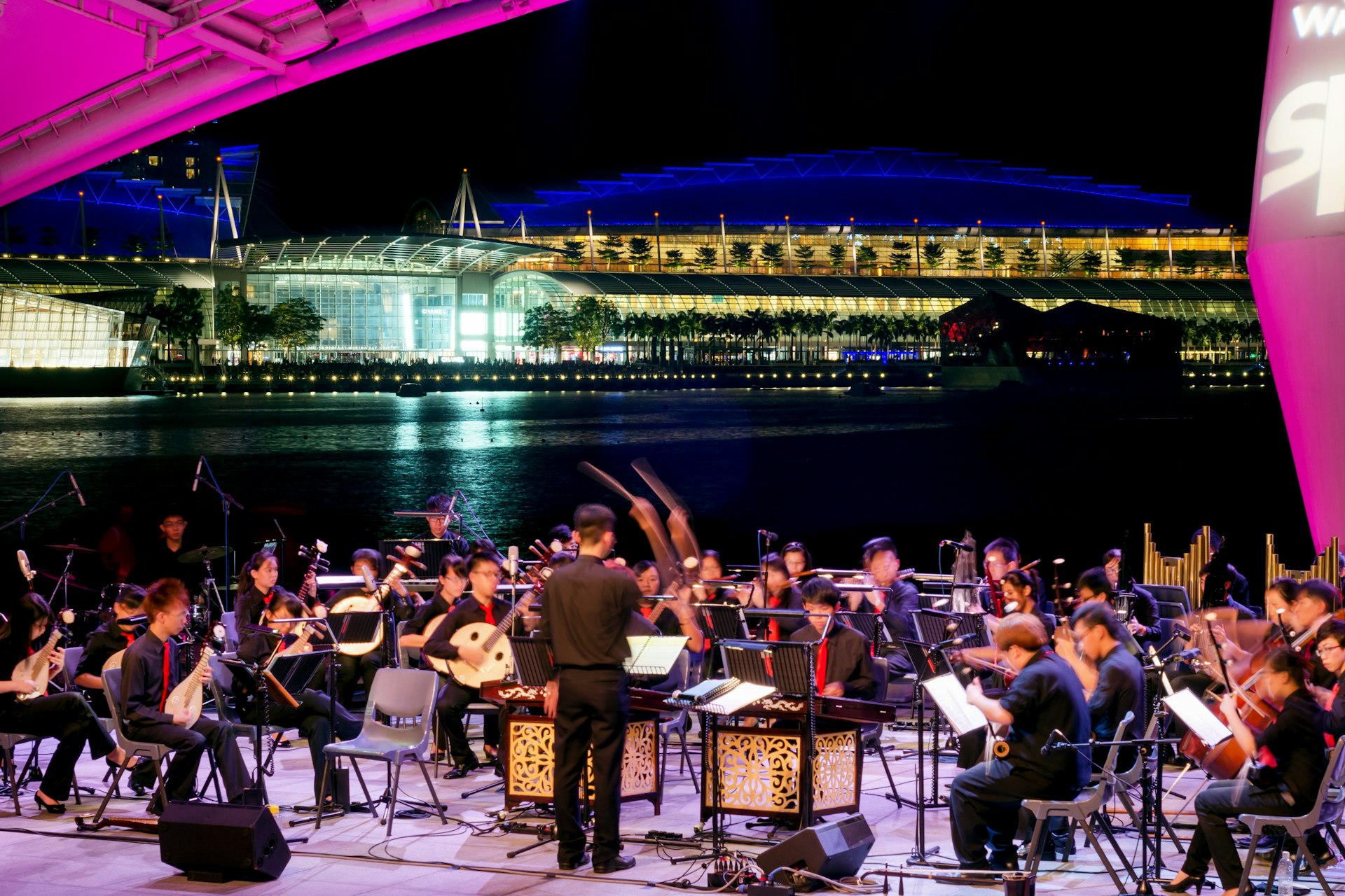 An orchestra plays in Singapore: Open Air Orchestra at the Esplanade Theater