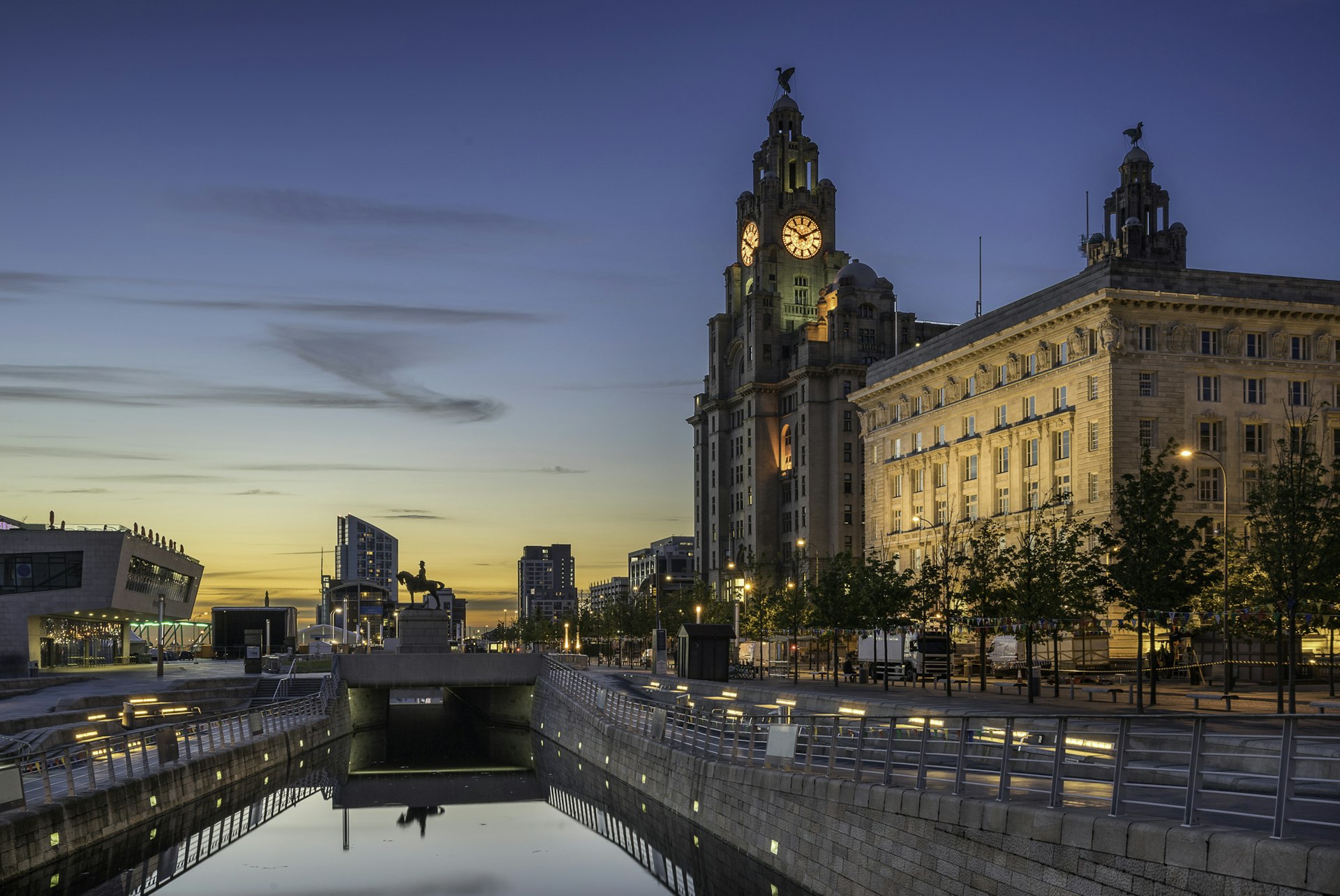 Dusk sky and The Three Graces which compromises the Liver Building, the Cunard and Port Authority 
