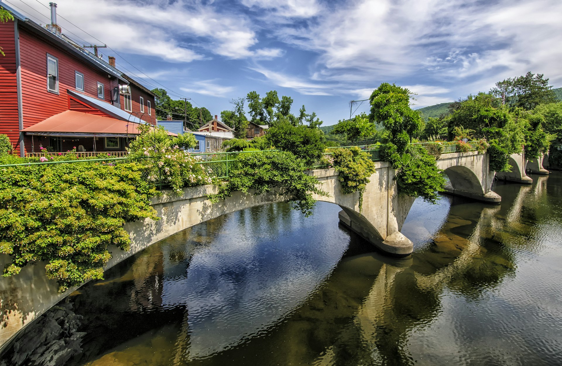 The greenery-covered Bridge of Flowers, spanning the Deerfield River in the western Massachusetts town of Shelburne Falls
