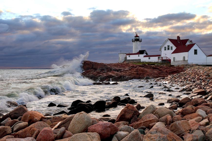 Wave crash on the rocks near Eastern Point Lighthouse on the eastern tip of Massachusetts, Gloucester Harbor, Gloucester, Massachusetts, New England, USA