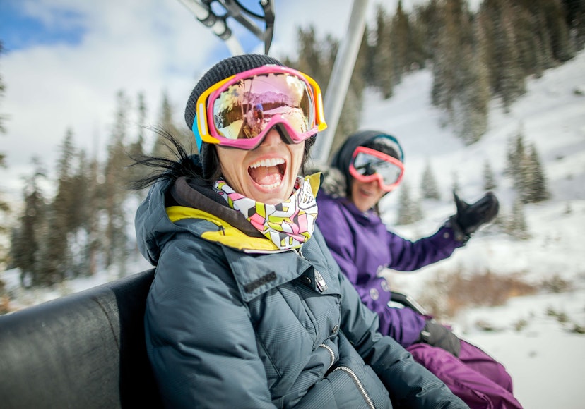 Girls having fun on chair lift at Vail, Colorado.