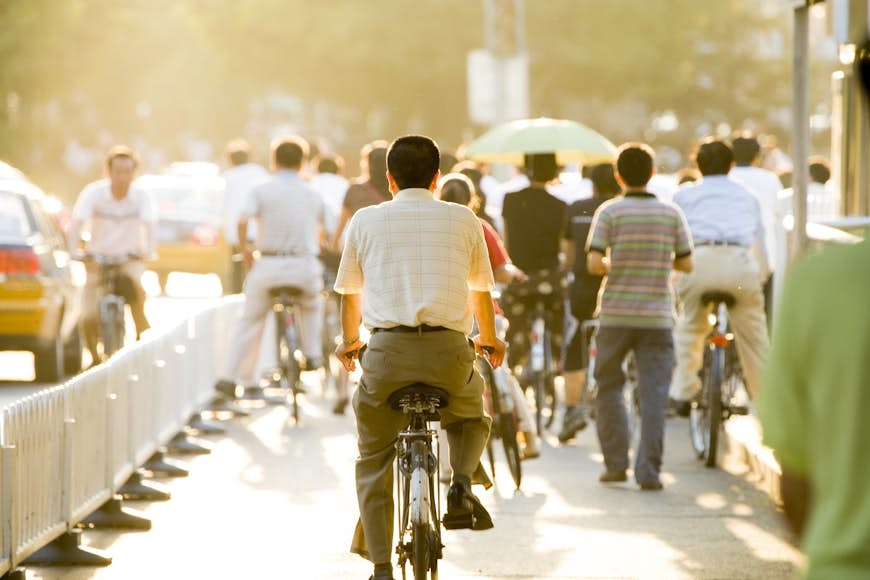 Cyclists in afternoon rush hour in Chaoyang. 