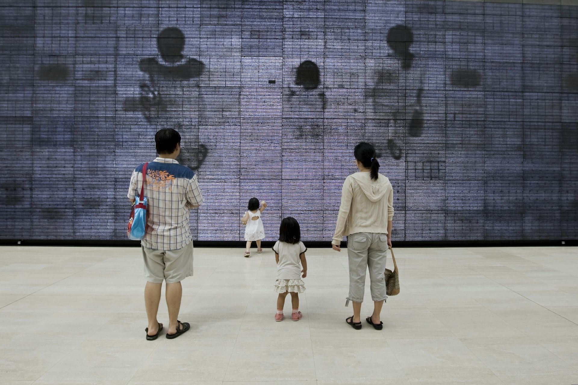 Family looking at work at the National Museum of Singapore 
