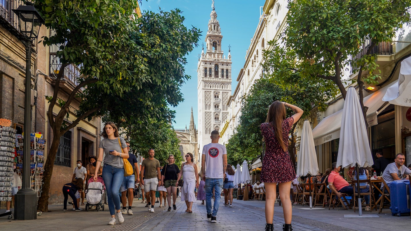 SEVILLE ANDALUSIA, SPAIN - OCTOBER 11: Large number of tourists by the environment of the Cathedral of Seville, during the Puente del Pilar to 11 October 2021 in Seville, Spain. The occupation of the hotels of Seville are at 80 percent compared to those of 2019, before the Covid-19 pandemic. (Photo By Eduardo Briones/Europa Press via Getty Images)
