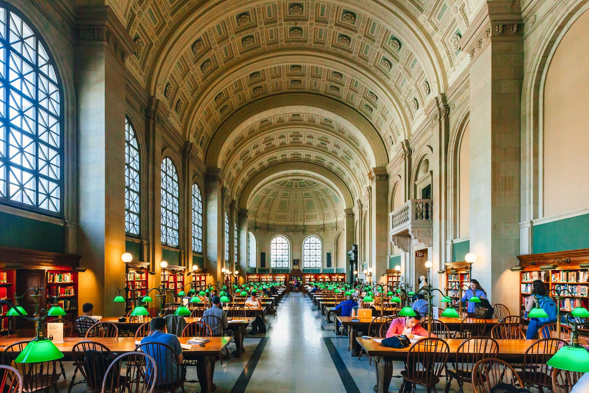 Locals study and read books in the Reading Room at McKim Building of Boston Public Library Mark Zhu shutterstock_1281635212 rfc.jpg