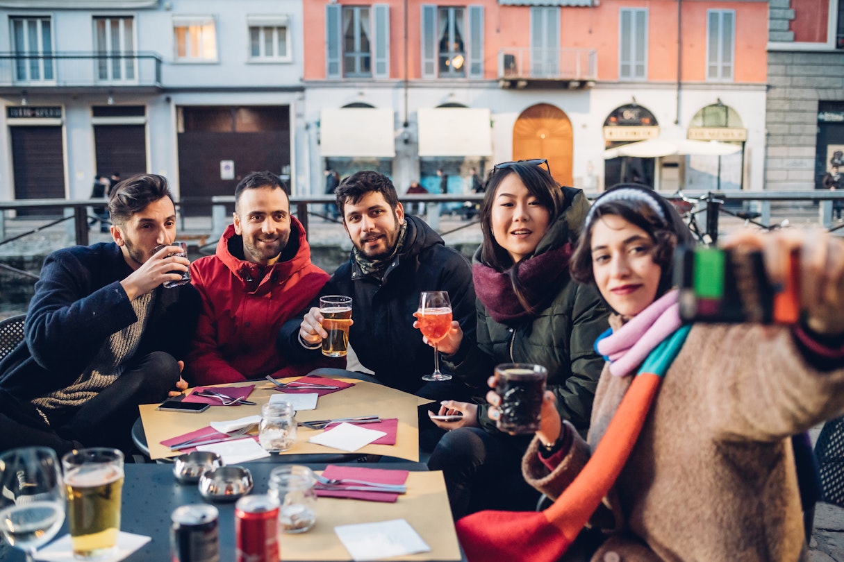 Enjoying a drink in an outdoor cafe is all part of the beauty of Milan's neighborhoods