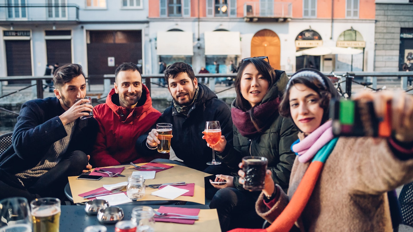Enjoying a drink in an outdoor cafe is all part of the beauty of Milan's neighborhoods