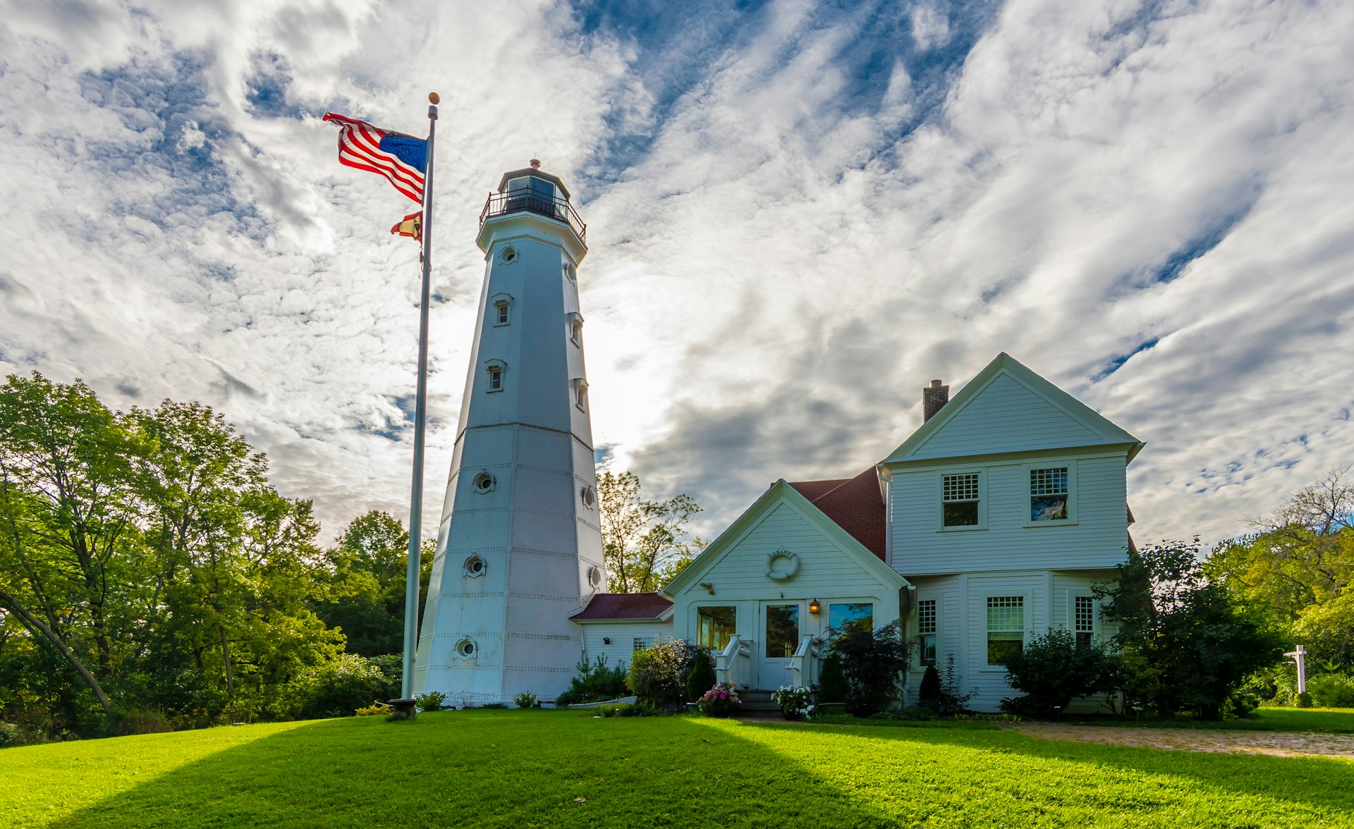 North Point Lighthouse in Milwaukee with American flag flying