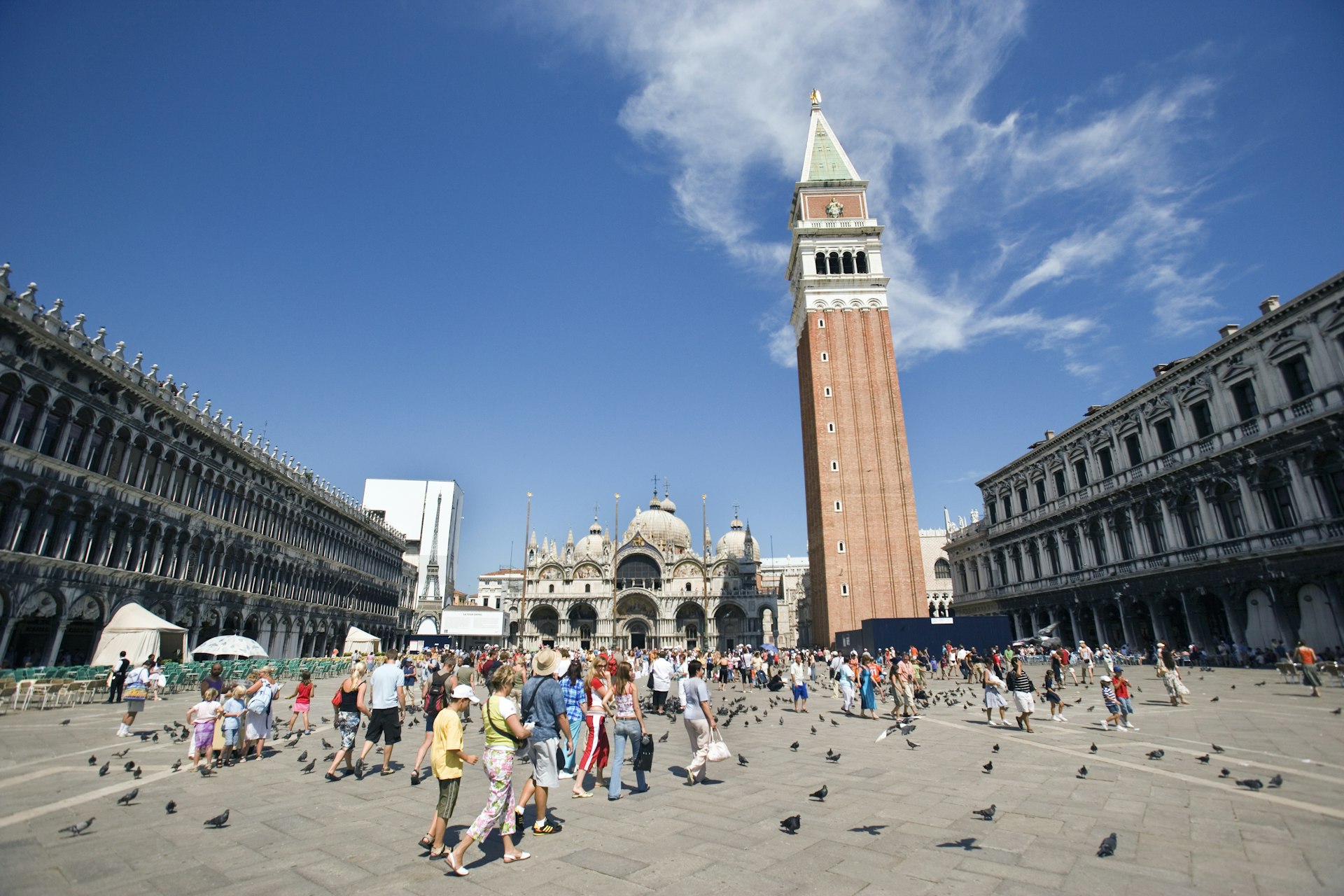 Piazza San Marco in Venice full of visitors with the Campanile Bell Tower dominating the view