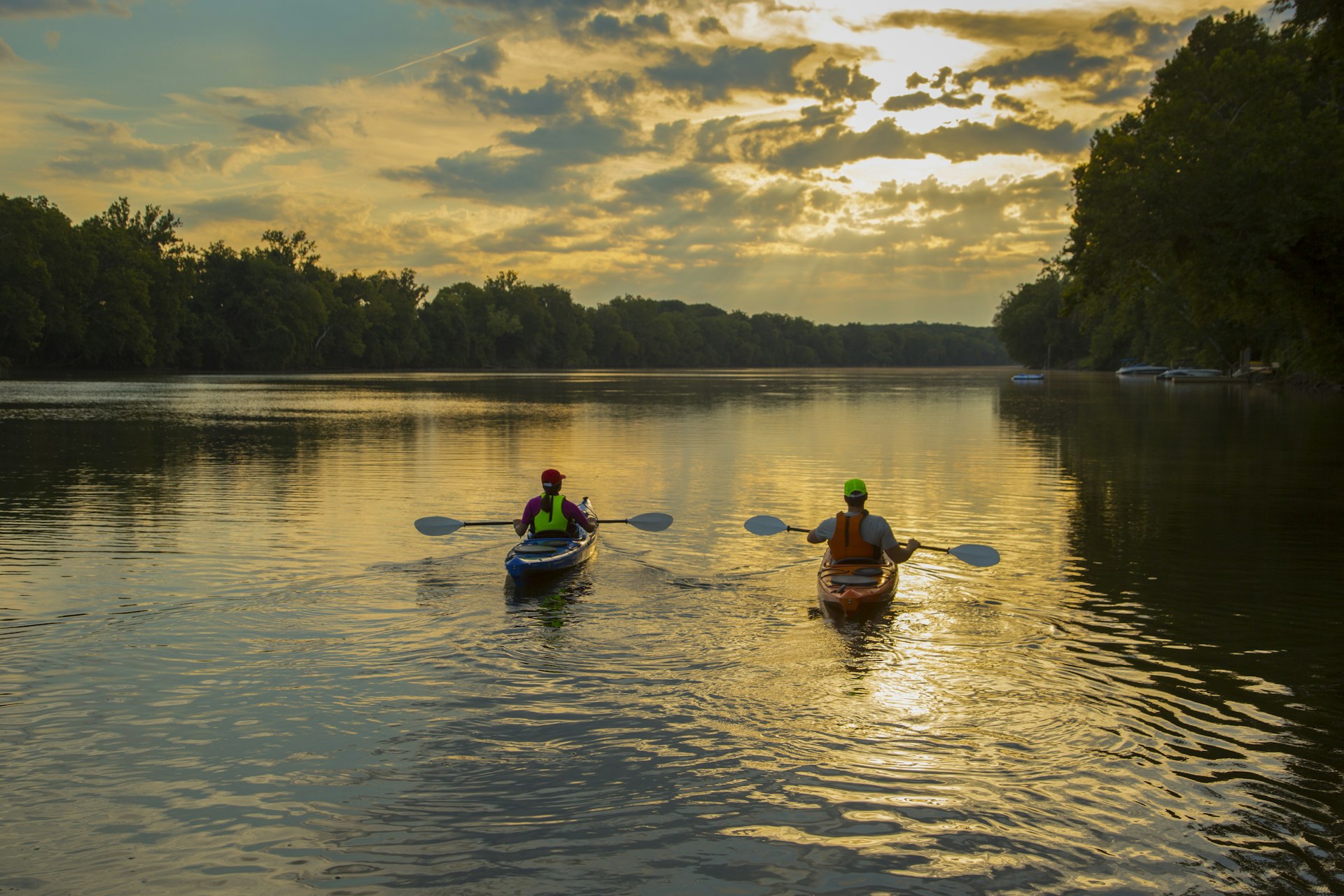 Couple kayaking in the James River at sunset in Richmond, Virginia
